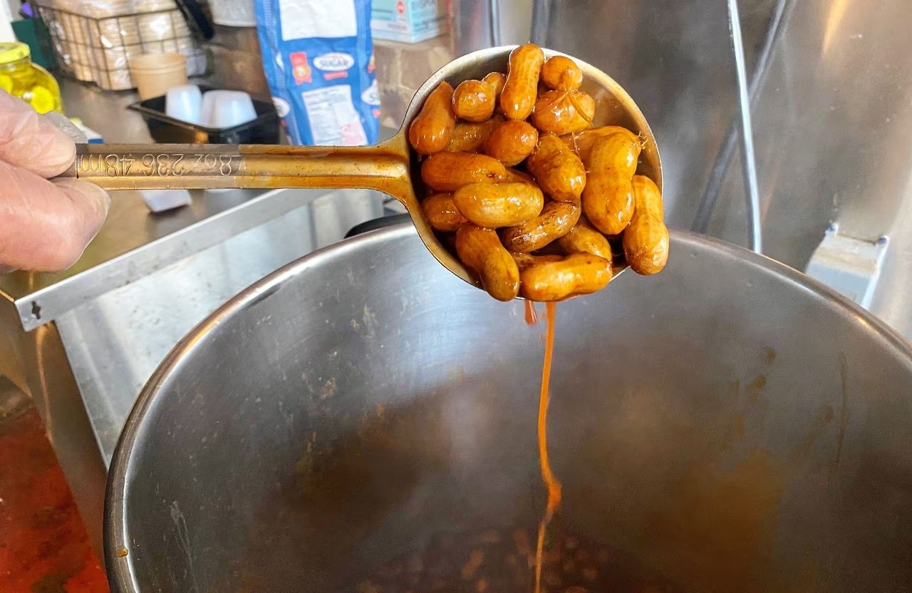 Peanuts in ladle with sauce